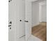 Hallway view toward a bathroom with white marble floor and bath/shower combo at 2833 Auldreeke Rd, Johns Island, SC 29455