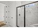 Glass enclosed shower with white marble walls in a modern bathroom at 2833 Auldreeke Rd, Johns Island, SC 29455