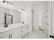 Bathroom featuring double sink vanity, marble floors, and glass shower at 2833 Auldreeke Rd, Johns Island, SC 29455