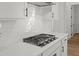 Gas range cooktop in a modern white kitchen with subway tile backsplash at 2833 Auldreeke Rd, Johns Island, SC 29455