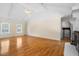 Bright living room with vaulted ceilings, wood floors, and a fireplace with washer/dryer closet at 125 Bramwell Dr, Summerville, SC 29485