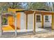 Charming backyard patio with pergola and painted wood fence at 32 Briarcliff Dr, Charleston, SC 29407