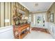 Elegant foyer featuring a decorative table, mirror, and a view of the front door with sidelights at 177 Thousand Oaks Cir, Goose Creek, SC 29445