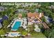 An aerial view shows the Cassique Sports Pavillion with a pool, tennis courts, and lush landscaping at 169 Marsh Island Dr, Kiawah Island, SC 29455