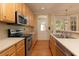 Kitchen boasts stainless steel appliances and light wood cabinets at 524 Shem Butler Ct, Charleston, SC 29414