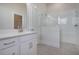 Bathroom with white vanity, walk-in shower, and hexagon floor tiles at 321 Trailmore Ln, Summerville, SC 29486