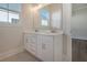 Double vanity bathroom with white cabinets and hexagon tile flooring at 321 Trailmore Ln, Summerville, SC 29486