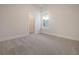 Bright bedroom featuring neutral carpeting and a spacious closet at 321 Trailmore Ln, Summerville, SC 29486
