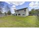 Spacious backyard featuring a well-maintained lawn, privacy fence, and mature trees at 174 Education Blvd, Ladson, SC 29456