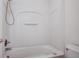 Neat bathroom with a shower and bathtub combination, a white shower surround and chrome fixtures at 174 Education Blvd, Ladson, SC 29456