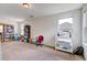 Bonus room featuring carpet floors and natural lighting from multiple windows at 174 Education Blvd, Ladson, SC 29456