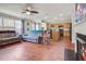 Open living space includes a fireplace, hardwood floors, ceiling fans and provides seamless access to the kitchen area at 174 Education Blvd, Ladson, SC 29456