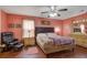 Cozy main bedroom with warm color, a ceiling fan, a comfortable bed, and warm lighting to create a relaxing space at 174 Education Blvd, Ladson, SC 29456