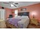 Cozy main bedroom with a ceiling fan, a comfortable bed, and warm lighting to create a relaxing space at 174 Education Blvd, Ladson, SC 29456