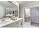 Bathroom with double vanity, walk-in closet and marble flooring at 462 Rowley Ln, Summerville, SC 29486