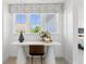 Bright home office featuring a white desk, wood chair, and window seat at 472 Rowley Ln, Summerville, SC 29486