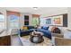 Bright living room with a sectional sofa and large windows at 472 Rowley Ln, Summerville, SC 29486