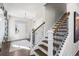 Bright entryway with hardwood floors and elegant staircase with dark wood accents at 472 Rowley Ln, Summerville, SC 29486
