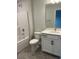 Clean bathroom with white vanity, tub shower combo, and gray tile floor at 746 Opal Wing St, Moncks Corner, SC 29461