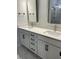 Double vanity bathroom with white cabinets and marble floors at 746 Opal Wing St, Moncks Corner, SC 29461