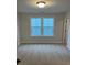 Bright bedroom featuring neutral walls and plush carpeting at 746 Opal Wing St, Moncks Corner, SC 29461