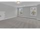 Spacious bedroom with plush carpet, light-filled windows, and neutral paint at 746 Opal Wing St, Moncks Corner, SC 29461