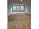 Spacious bonus room with neutral carpeting and natural light at 746 Opal Wing St, Moncks Corner, SC 29461