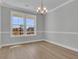 Charming dining room with laminate floor, chandelier lighting, and natural light at 746 Opal Wing St, Moncks Corner, SC 29461