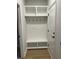 White entryway bench with storage and hooks at 746 Opal Wing St, Moncks Corner, SC 29461