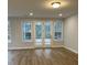 Spacious Gathering room with hardwood floors and access to a patio at 746 Opal Wing St, Moncks Corner, SC 29461