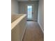 Upstairs hallway with carpeting and access to an exterior balcony at 746 Opal Wing St, Moncks Corner, SC 29461