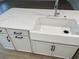 Modern farmhouse sink and white quartz countertop in a kitchen at 746 Opal Wing St, Moncks Corner, SC 29461