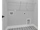 Efficient laundry area with modern tile flooring and utility connections at 746 Opal Wing St, Moncks Corner, SC 29461