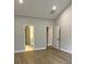 Main bedroom with hardwood floors and access to bathroom and closets at 746 Opal Wing St, Moncks Corner, SC 29461