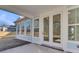 Covered back patio with wide sliding glass doors perfect for outdoor living and entertaining at 746 Opal Wing St, Moncks Corner, SC 29461