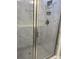 Elegant shower with marble tile walls and a gray hexagonal floor at 746 Opal Wing St, Moncks Corner, SC 29461
