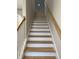 Elegant staircase with light oak treads and white risers at 746 Opal Wing St, Moncks Corner, SC 29461