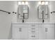 Modern bathroom featuring double sinks with quartz countertops, sleek black hardware, and minimalist mirrors at 357 Wappoo Trace Ln, Summerville, SC 29486