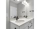 Bathroom with double sink vanity, white countertop, and modern fixtures at 357 Wappoo Trace Ln, Summerville, SC 29486