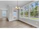 Bright dining area featuring large windows and an elegant chandelier at 357 Wappoo Trace Ln, Summerville, SC 29486