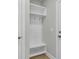 Mudroom entryway with built-in bench, hooks, and shelving for organization at 357 Wappoo Trace Ln, Summerville, SC 29486