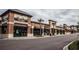 Image of retail shops featuring brick facade, large windows, and sidewalk access at 369 Wappoo Trace Ln, Summerville, SC 29486