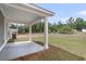 View of the patio featuring a concrete pad, white beams, and views of the surrounding landscaping and trees at 176 Cantona Dr, Summerville, SC 29483