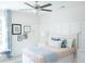 Bright bedroom featuring board and batten accent wall and ceiling fan at 300 Whispering Breeze Ln, Summerville, SC 29486