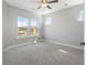 This bedroom features plush carpet, natural light, and a modern ceiling fan at 341 Trailmore Ln, Summerville, SC 29486