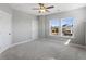 This bedroom features plush carpet, natural light, and a modern ceiling fan at 341 Trailmore Ln, Summerville, SC 29486