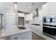 Bright kitchen with white cabinets, quartz countertops, stainless steel appliances, and a center island perfect for cooking at 341 Trailmore Ln, Summerville, SC 29486