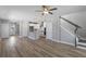 Open-concept living room with staircase, creating a spacious and inviting area at 341 Trailmore Ln, Summerville, SC 29486