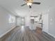 Spacious living room with modern kitchen featuring stainless steel appliances, a center island, and pendant lighting at 341 Trailmore Ln, Summerville, SC 29486