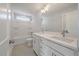 Clean, neutral bathroom with double sink vanity, large mirror and tub and shower combination for modern living at 7038 Elm Tree Ln, Johns Island, SC 29455